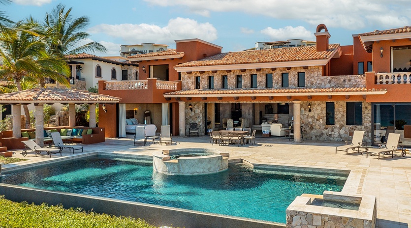 Poolside view of gorgeous villa exterior