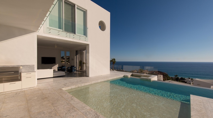 Modern villa featuring stunning sea views and private pool on expansive terrace with contemporary architecture.
