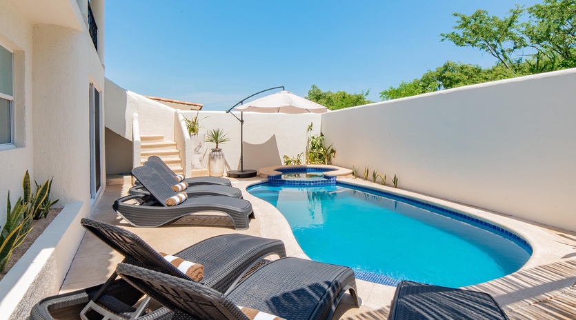 Inviting outdoor terrace with swimming pool, jacuzzi and patio furniture