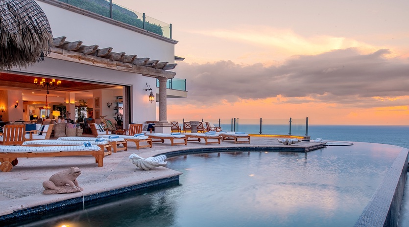 Poolside with ocean views during sunset