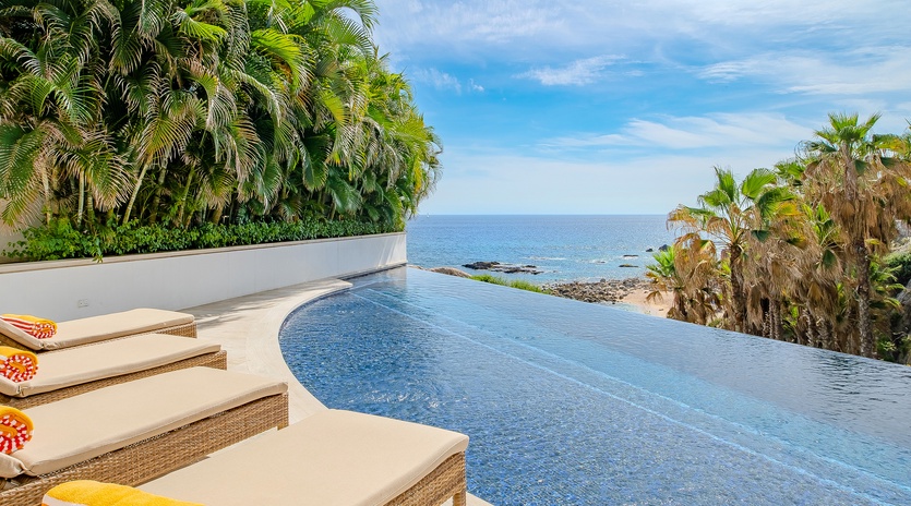 Swim in your private infinity pool while palm trees sway and endless ocean views stretch to the horizon.