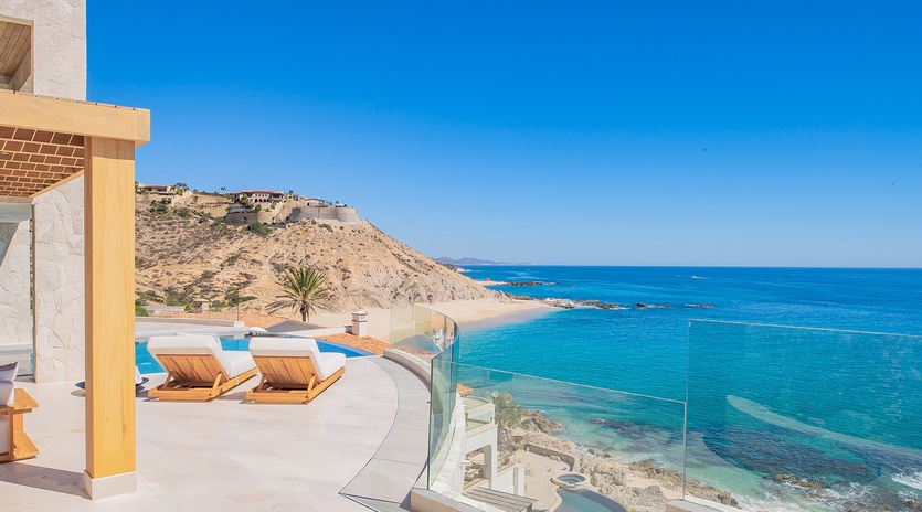 Sunny patio with amazing ocean and beachfront views
