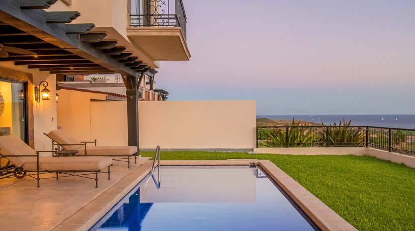 Poolside with ocean view during sunset