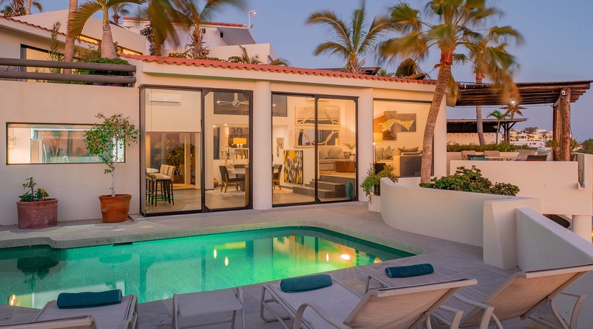 Poolside view of exterior during sunset