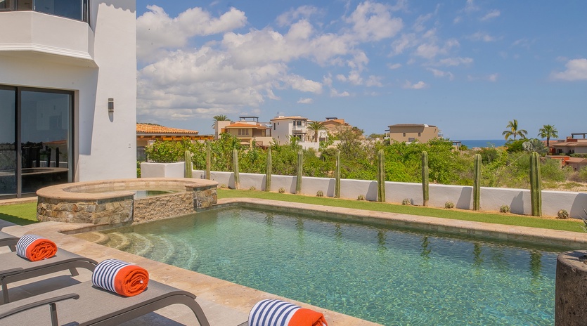Sunny poolside with lounge