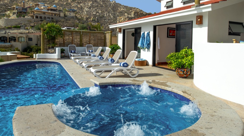 Soak in your bubbling hot tub while gazing at mountain views, then lounge poolside on comfortable chairs.