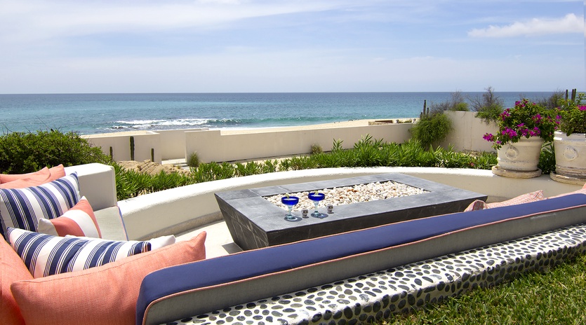 Patio with firepit and an beachfront view