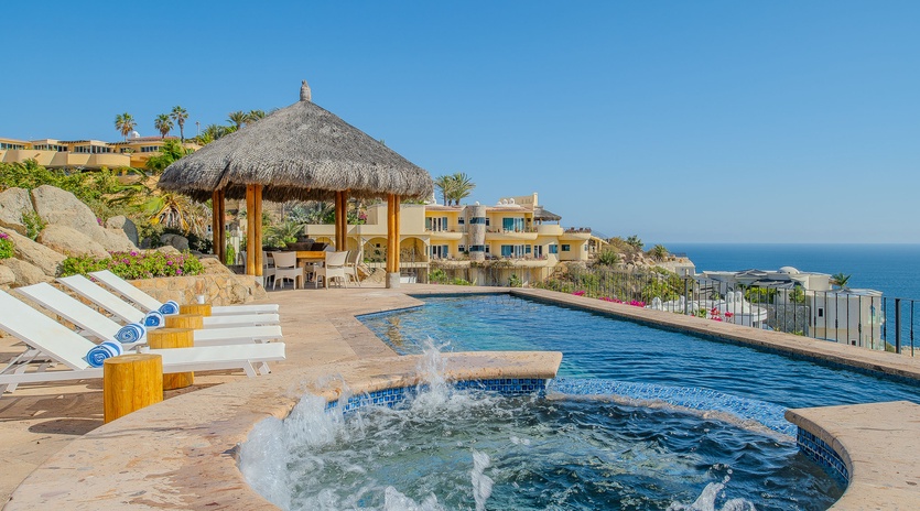 Unwind by your private pool with bubbling spa jets while taking in stunning ocean views from this hillside paradise.