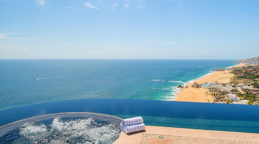 Jacuzzi and infinity pool overlooking beachfront views