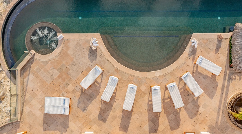 Aerial view of patio with jacuzzi and infinity pool