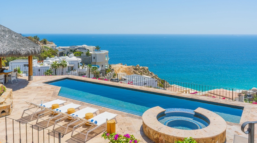Breathtaking infinity pool overlooking crystal-clear waters, perfect for soaking up sun while enjoying panoramic ocean views.