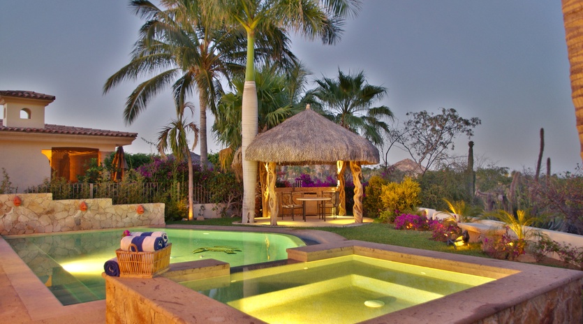 Jacuzzi and pool during evening
