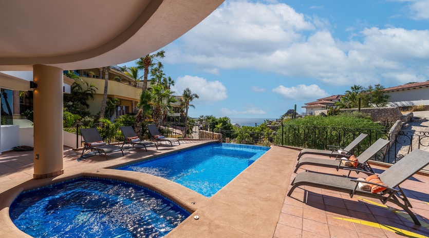 Sunny patio with jacuzzi and ocean view