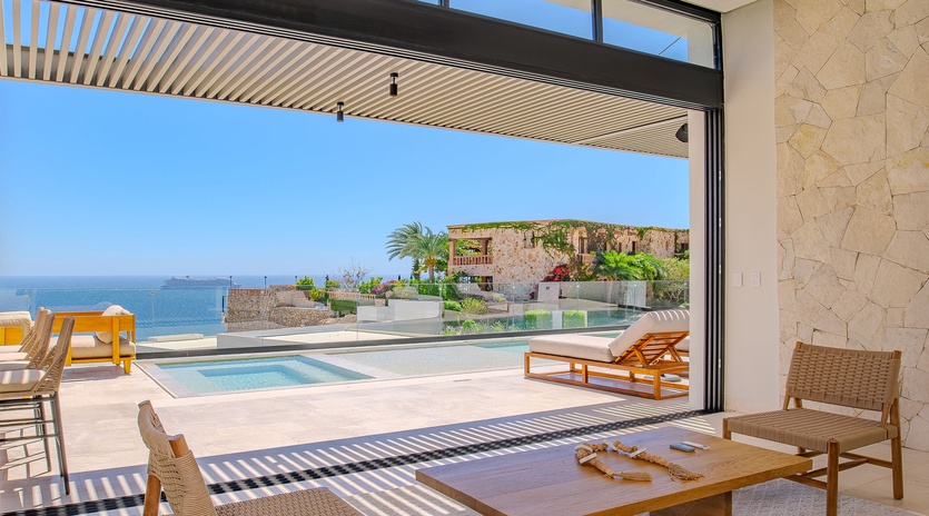 Relax in your private open-plan living space with stunning ocean views and direct pool access.
