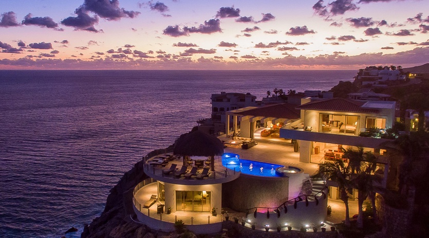 Bird's eye view of villa during sunset