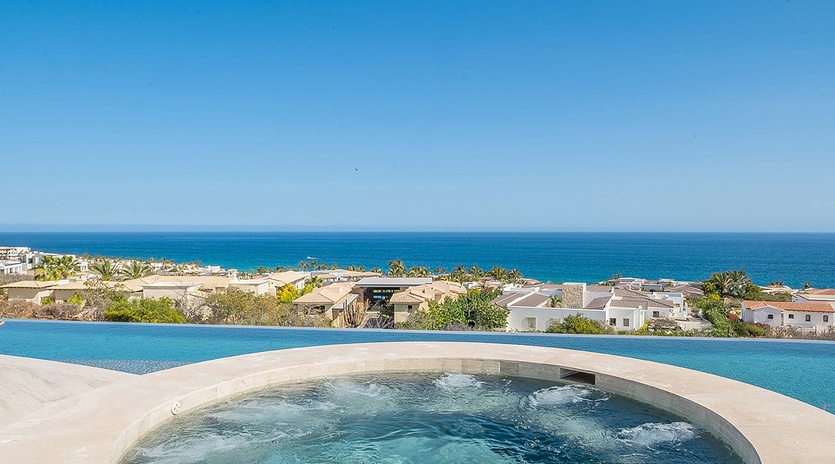 Soak in the bubbling hot tub while gazing at stunning ocean views stretching to the horizon. A perfect spot to unwind after a day of exploring the coastline.