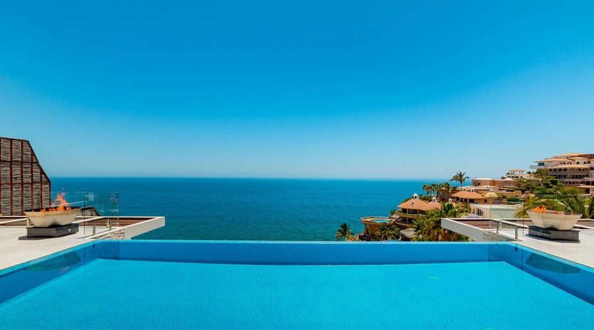 Infinity edge pool with lounge chairs
