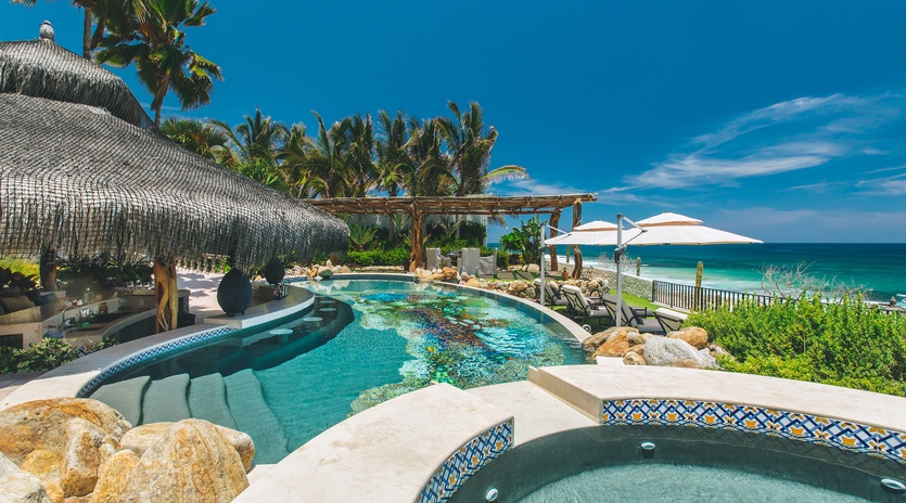 Pool and jacuzzi with beachfront views