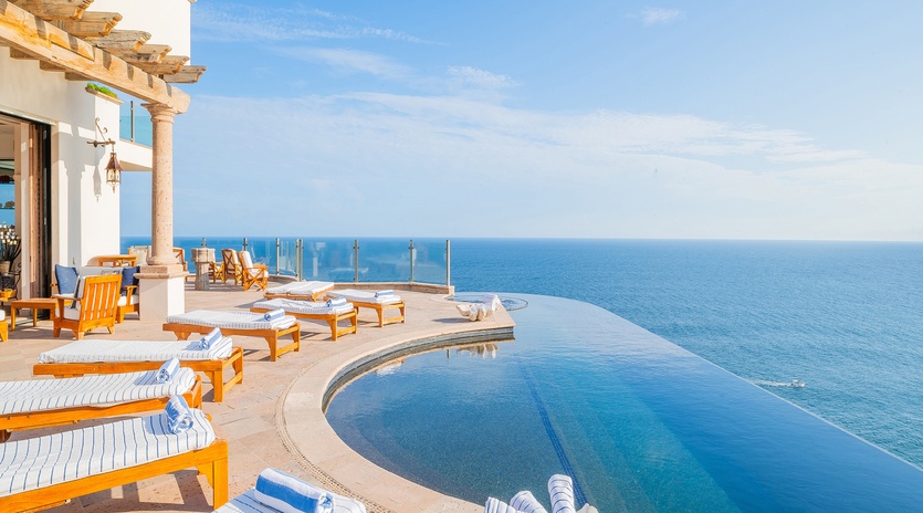 Sunny patio with infinity pool and incredible ocean views