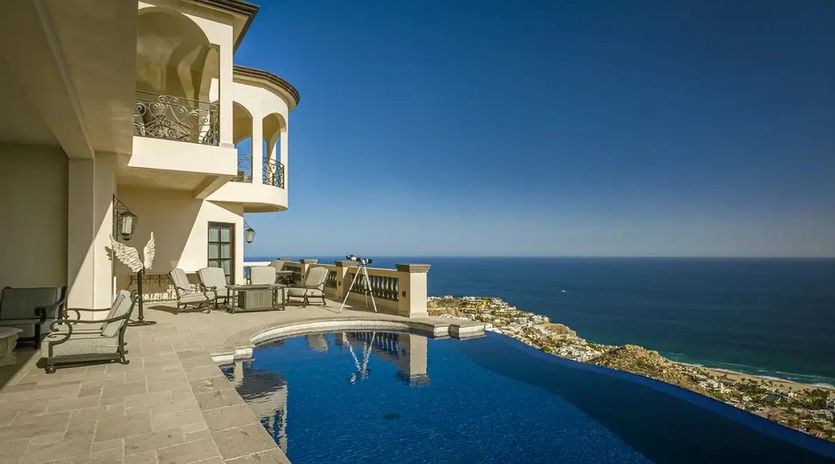 Sunny patio with pool and ocean views