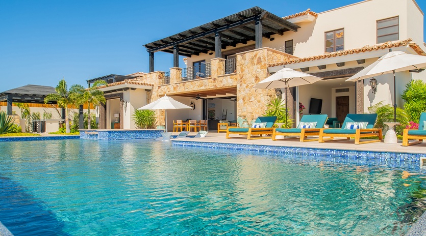 Stunning villa with pristine pool and elegant outdoor lounging areas for your perfect getaway retreat.