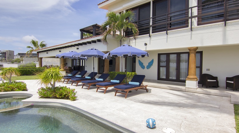 Poolside view with lounge chairs