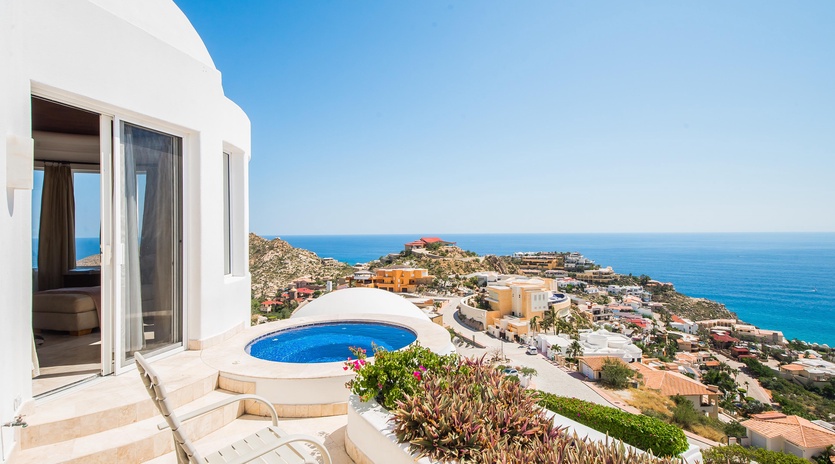 Outdoor patio with infinity pool and ocean view