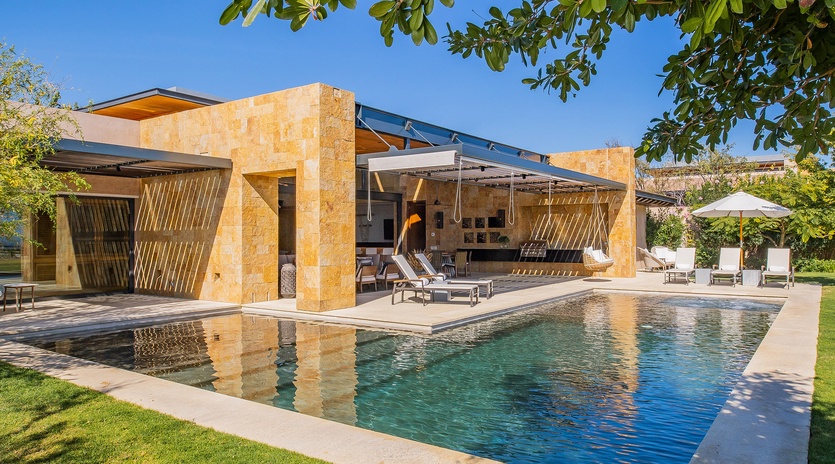Poolside with view of villa