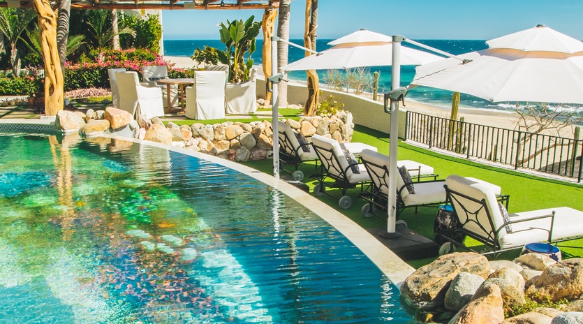 Poolside with beachfront views