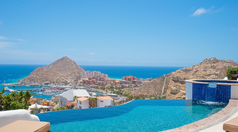 Infinity edge pool leads eye to marina view