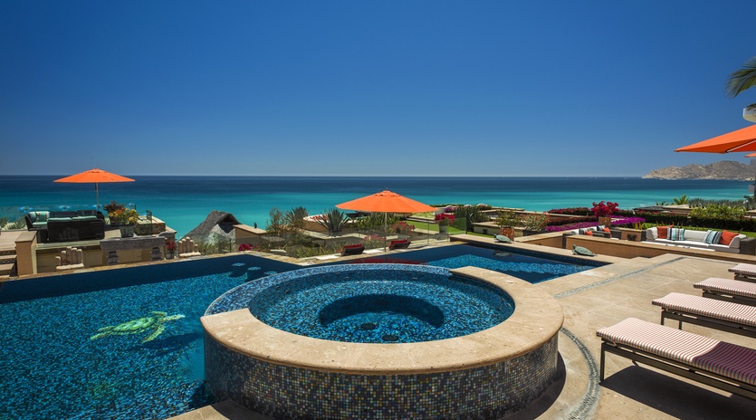Dive into luxury with your private infinity pool and hot tub, where turquoise waters blend seamlessly with the ocean horizon.