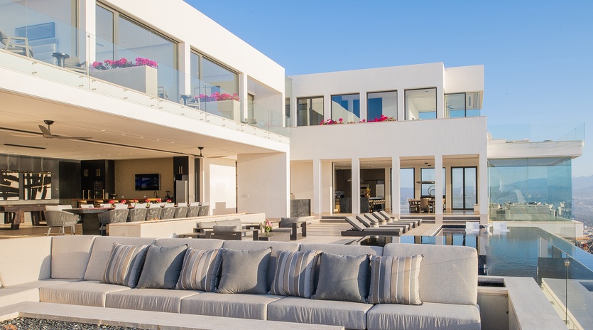 Poolside with incredible ocean and city views at night