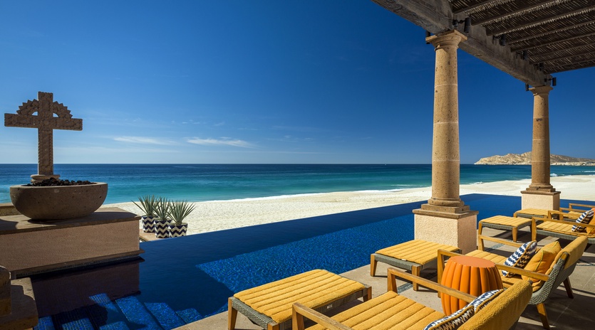 Unwind on your private infinity terrace where azure waters meet pristine sand, creating your perfect beachfront escape.