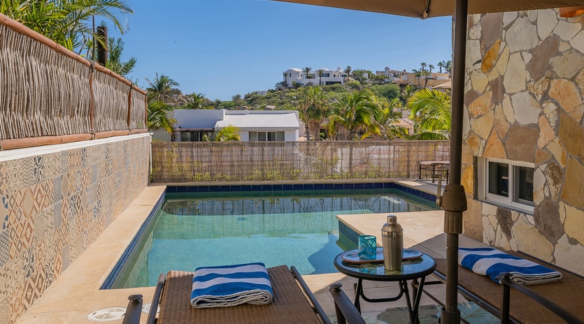 Lounge chairs with poolside view