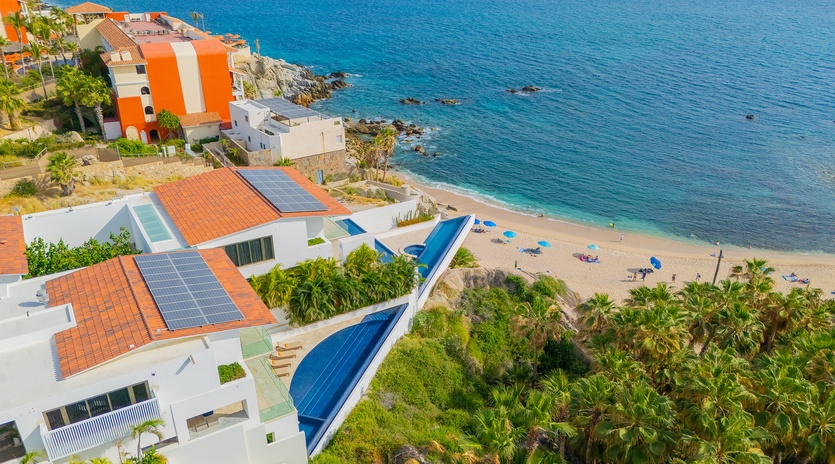 Stunning beachfront property with private pool overlooking pristine sandy beach and crystal-clear Caribbean waters.