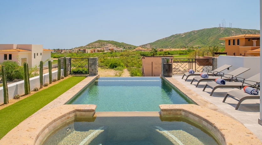 Pool view surrounded by mounrtains and oceans