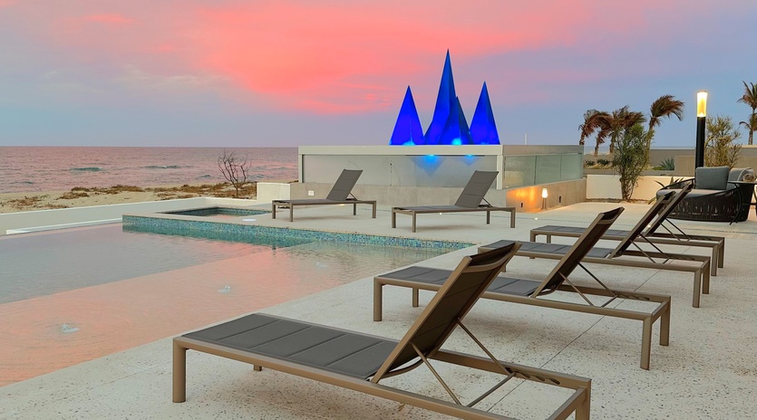 Lounge poolside with beachfront views