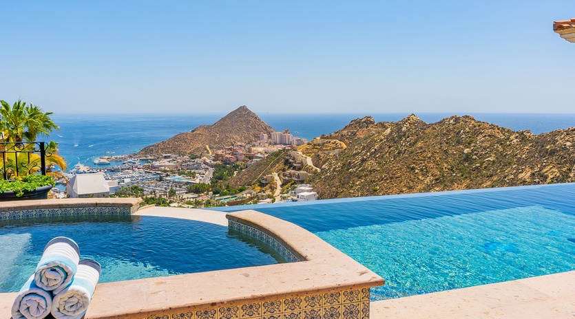 Dive into your private infinity pool while soaking up breathtaking ocean and mountain views that stretch endlessly before you.