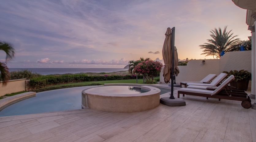 Patio with ocean views during sunset