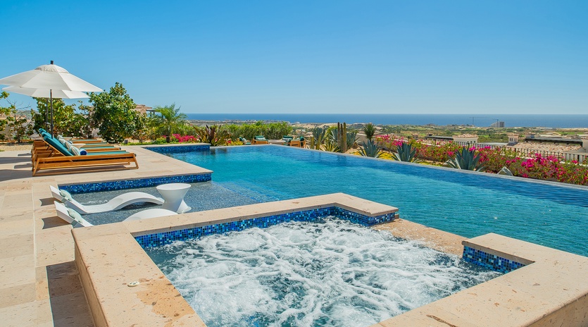 Soak in your private hot tub while gazing at endless ocean views, then cool off in the infinity pool.
