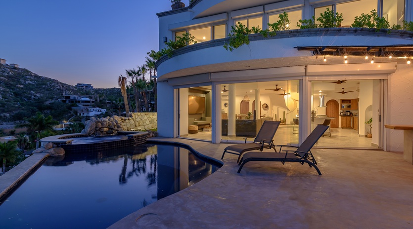 Poolside with ocean views during night time