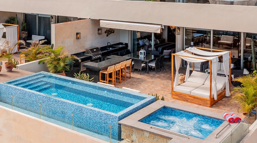 Sunny patio with pool, jacuzzi and lounge