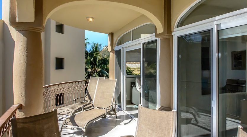 Sunny balcony with outdoor seating