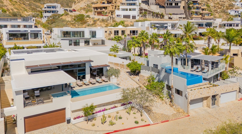 Stunning hillside development featuring modern villas with private pools nestled in tropical landscaping.