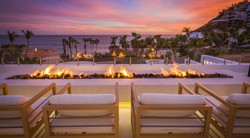 Firepit seating with ocean view during sunset