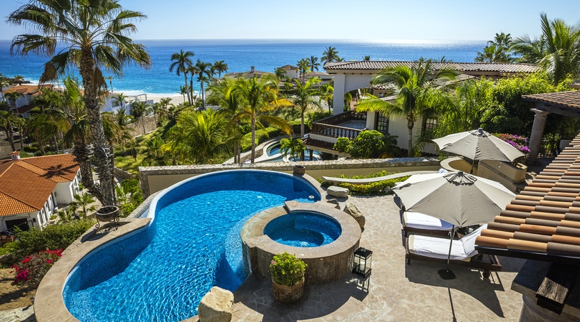 Patio with pool and jacuzzi with beach views