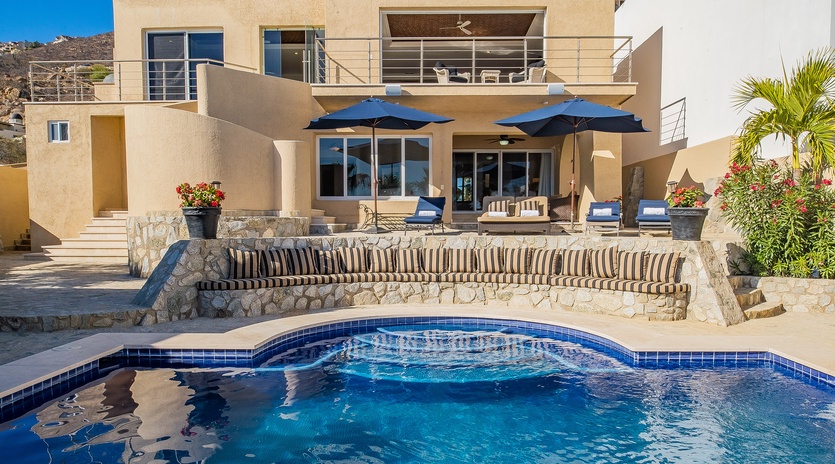 Lounging poolside with exterior view