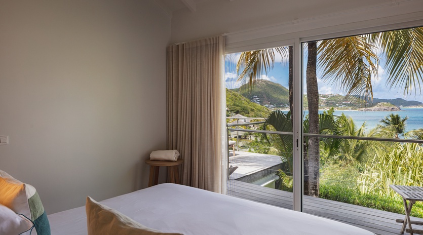 Wake up to turquoise waters framing tropical palms just beyond your window. Soft linens, bright ocean views, and Caribbean breezes create your perfect island retreat.