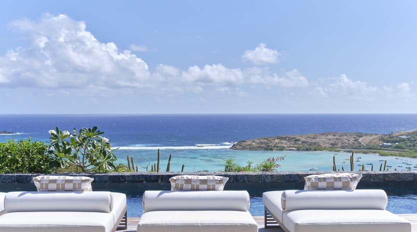 Stunning ocean views and turquoise waters create the perfect backdrop for your tropical getaway relaxation.