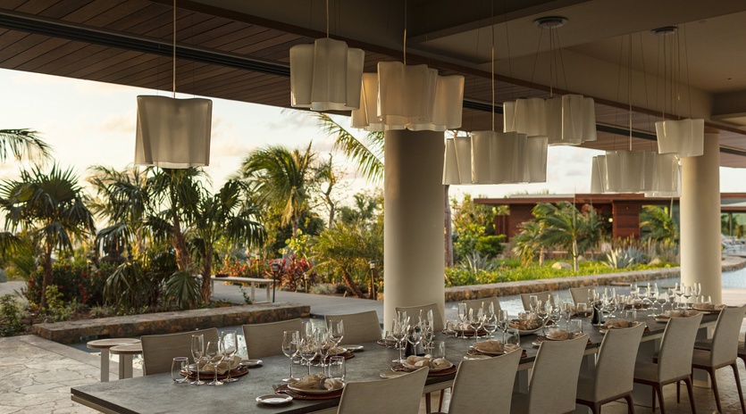 Savor exceptional cuisine at this elegant open-air restaurant with tropical garden views and sophisticated lighting.